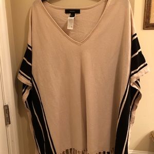 Tan and black poncho